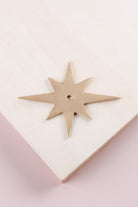 Satin brass star backplate, 87 x 68mm: solid brass with a 4mm centre hole for the knob bolt