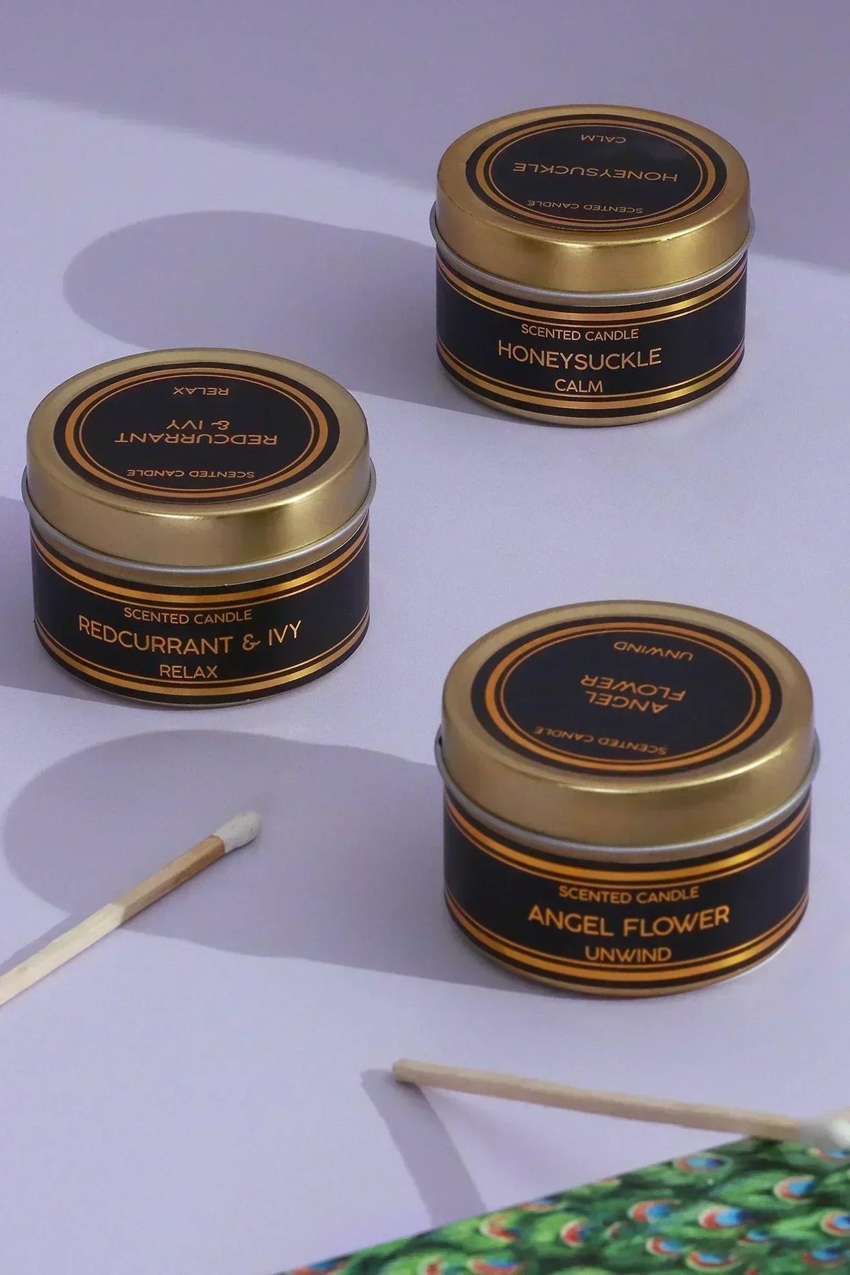 Scented Black Tin Candles Set of 3 in Angel Flower Honeysuckle and Redcurrant Ivy — close-up view, G Decor