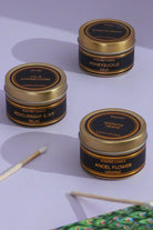 Scented Black Tin Candles Set of 3 in Angel Flower Honeysuckle and Redcurrant Ivy — close-up view, G Decor