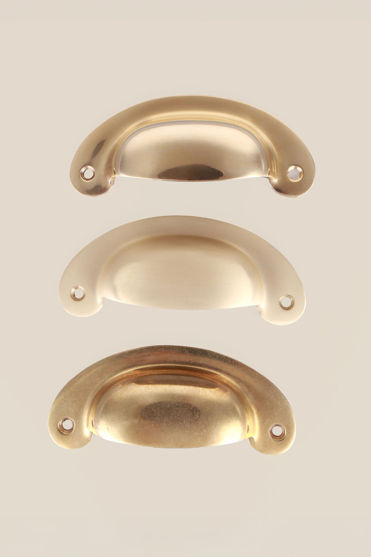 Slim crescent cup pull in polished, aged and satin brass, third view
