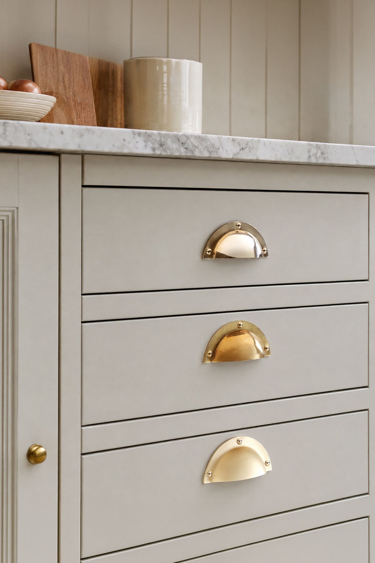 Stepped rim cup pull in polished, aged and satin brass