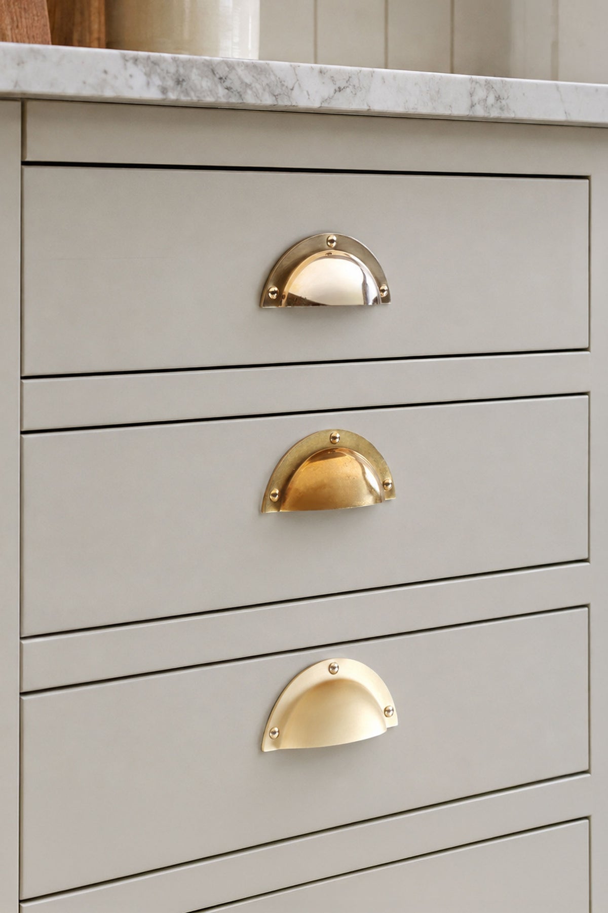 Stepped rim cup pull in polished, aged and satin brass, second view