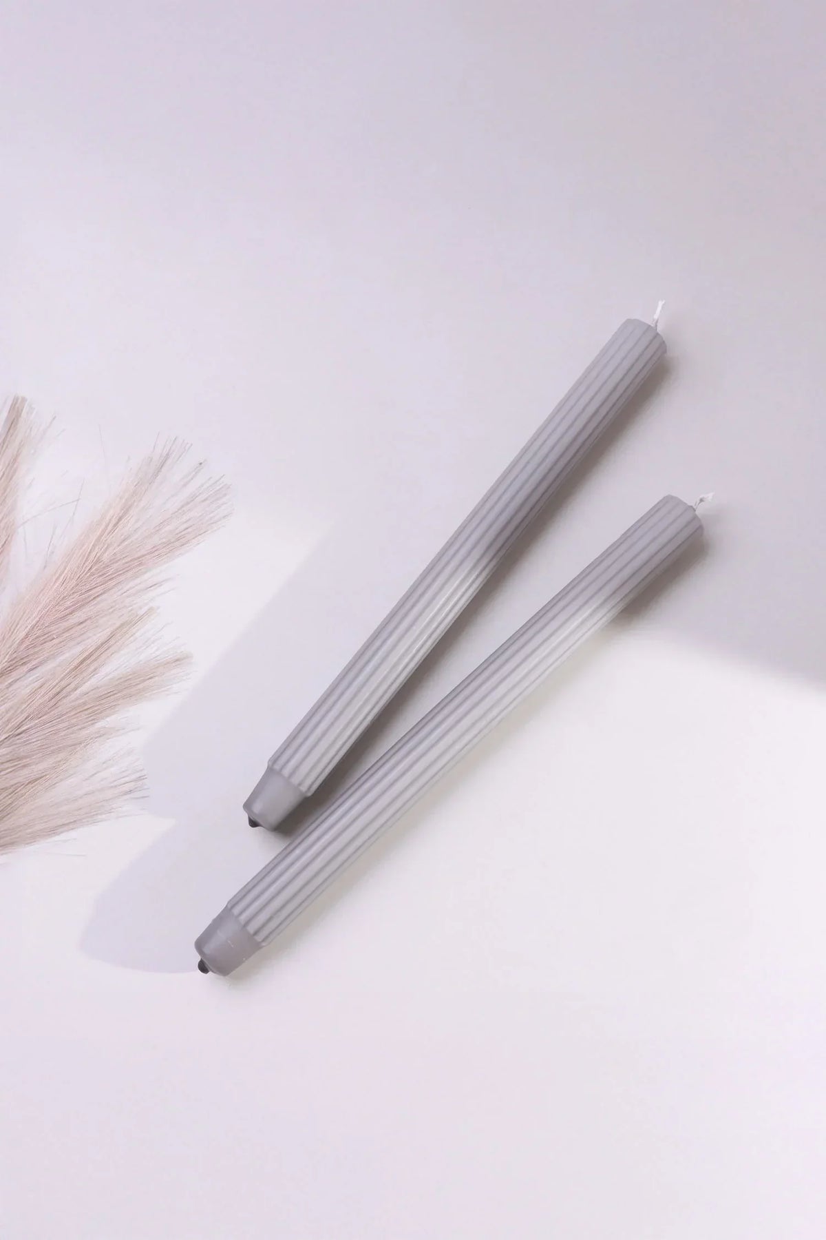 Velluto Cenere Pair of Ash Grey Ribbed Velvet Taper Candles — close-up view, G Decor