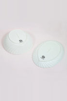 Underside of the shell bowl and the oval dish showing the G Decor stamp