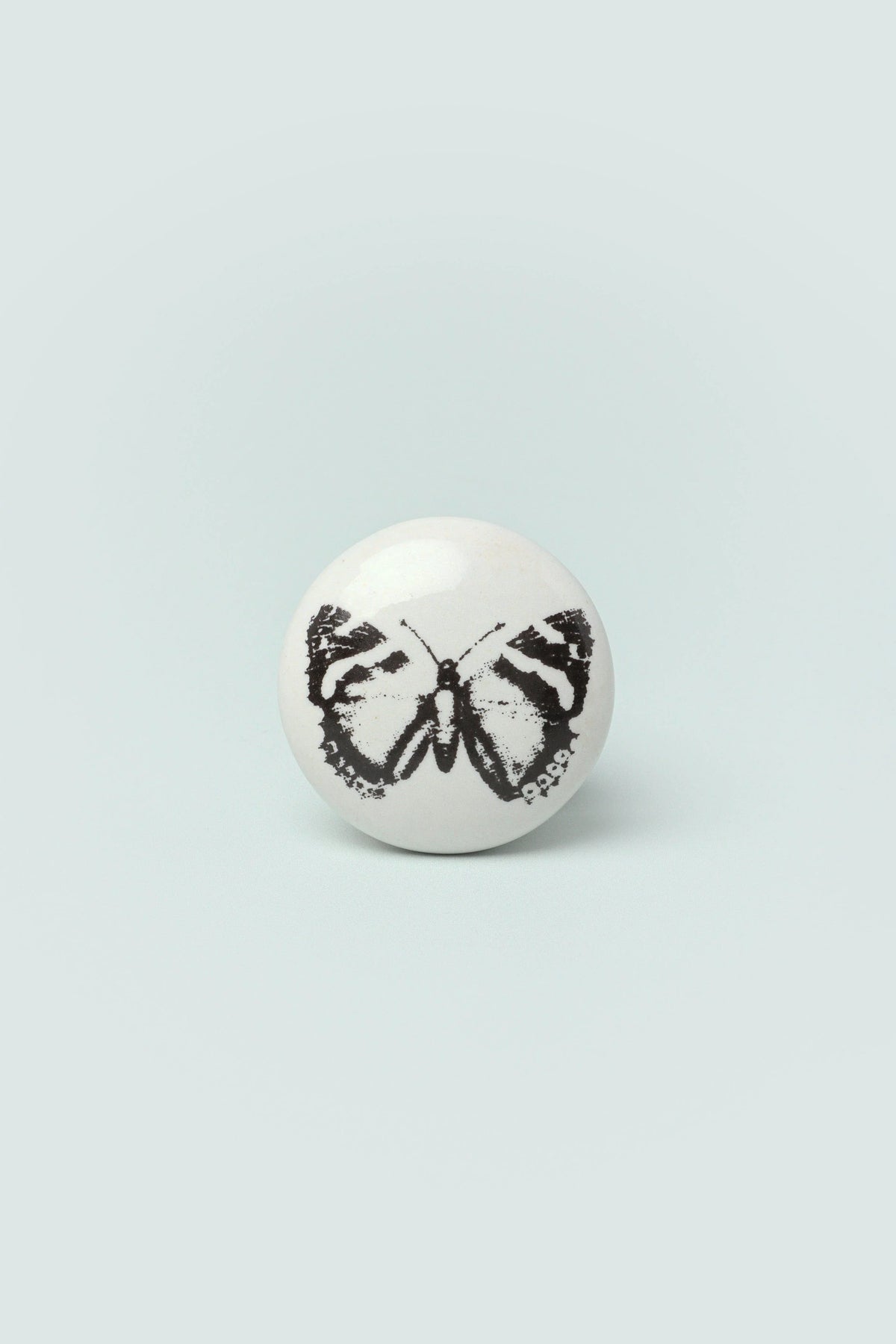 Butterfly Stamp Porcelain Cabinet Knob — close-up view, G Decor