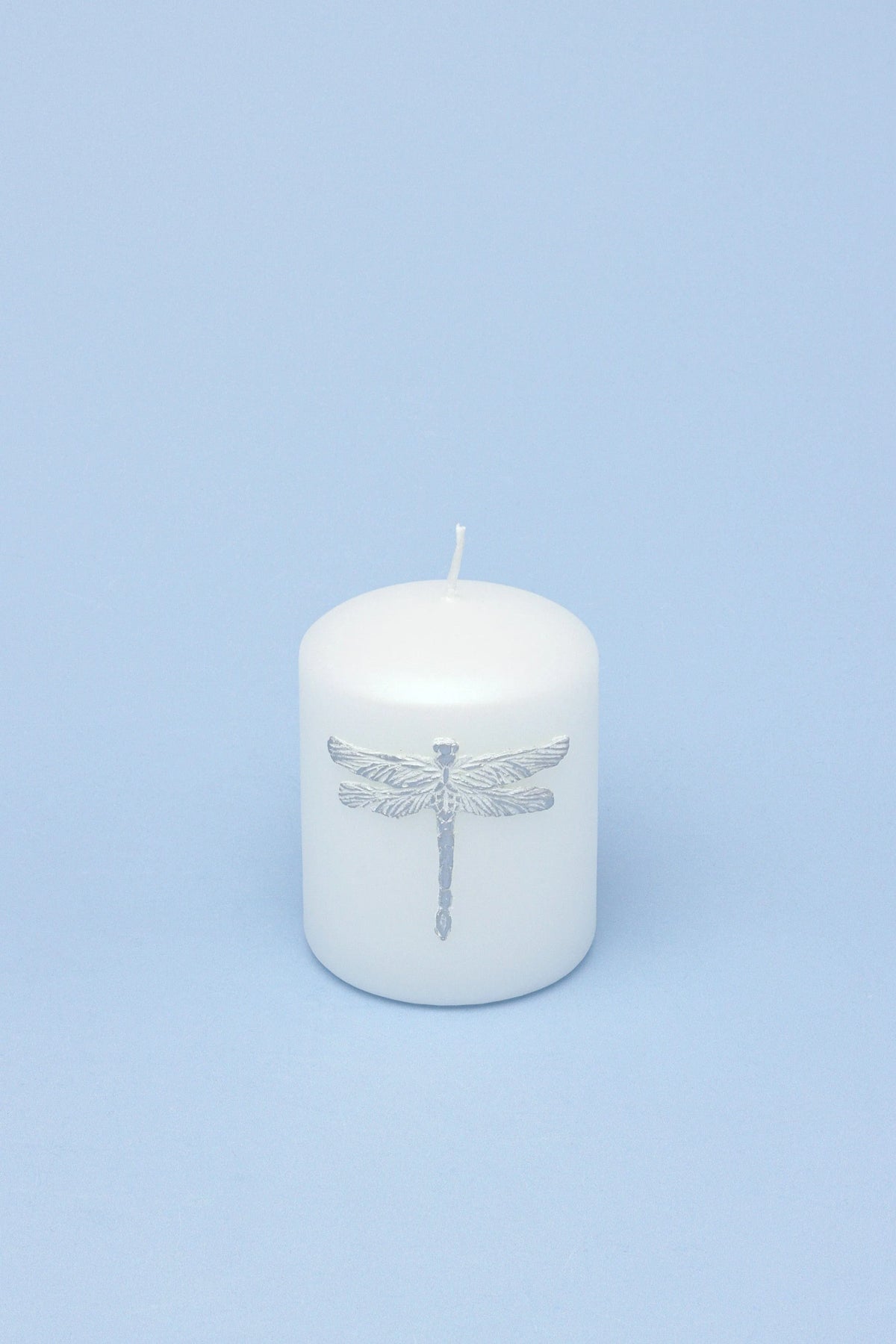 Dragonfly Queen White Pillar Candle with Silver Emblem — close-up view, G Decor