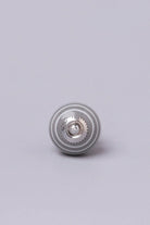 White Striped Ceramic Cabinet Knob in Purple and Dark Grey — close-up view, G Decor